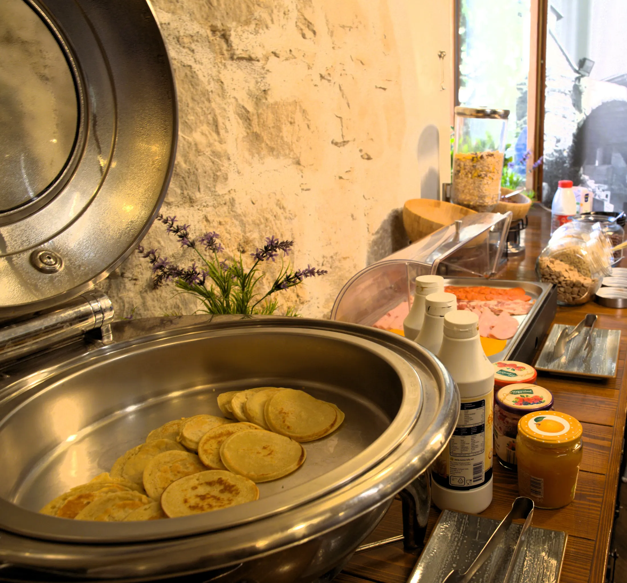 Pancakes in a warming dish on the breakfast buffet, Pizzeria Villa Diana, Lučac, Split