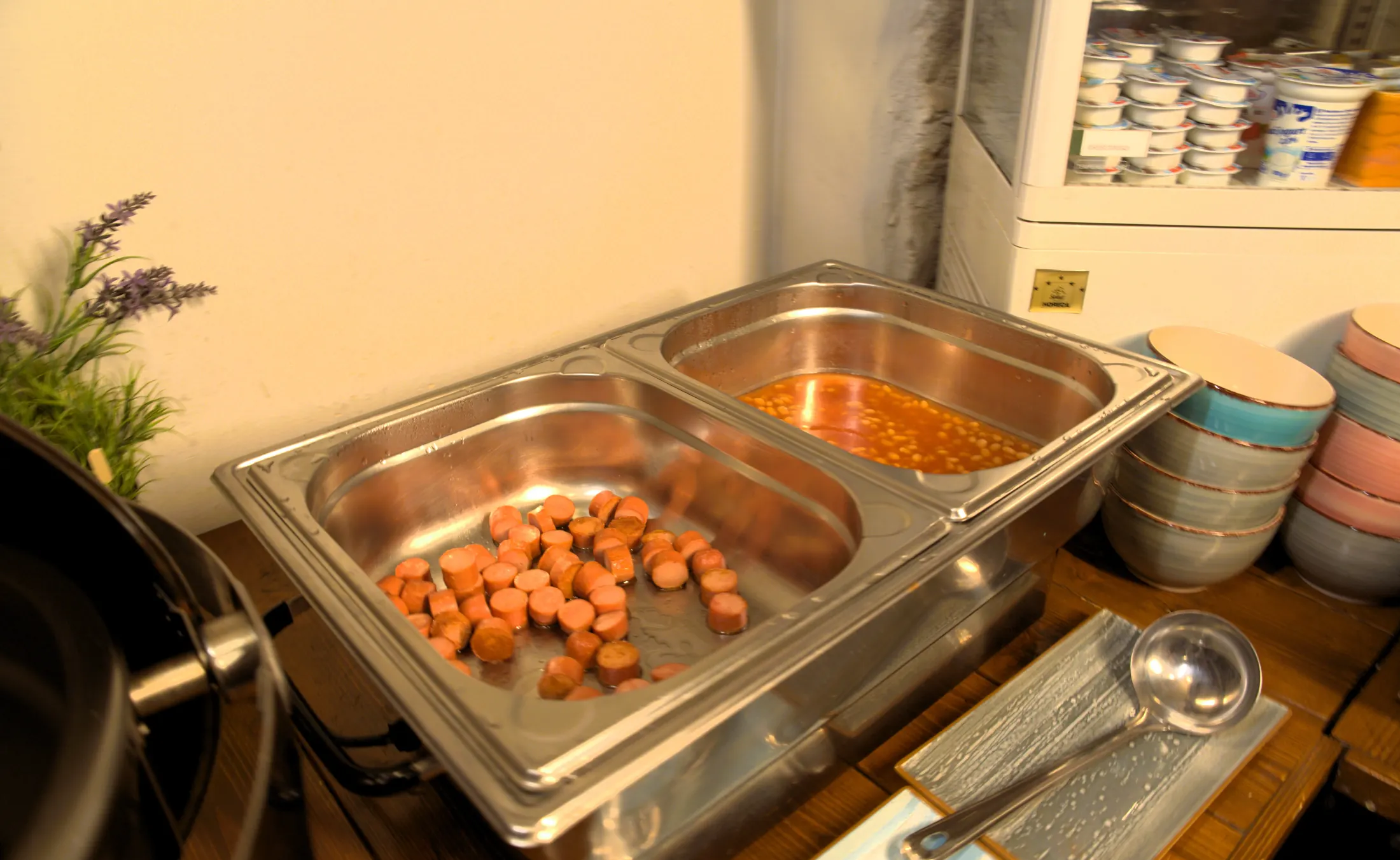 Sausages and beans in warming dishes on the breakfast buffet, Pizzeria Villa Diana, Lučac, Split