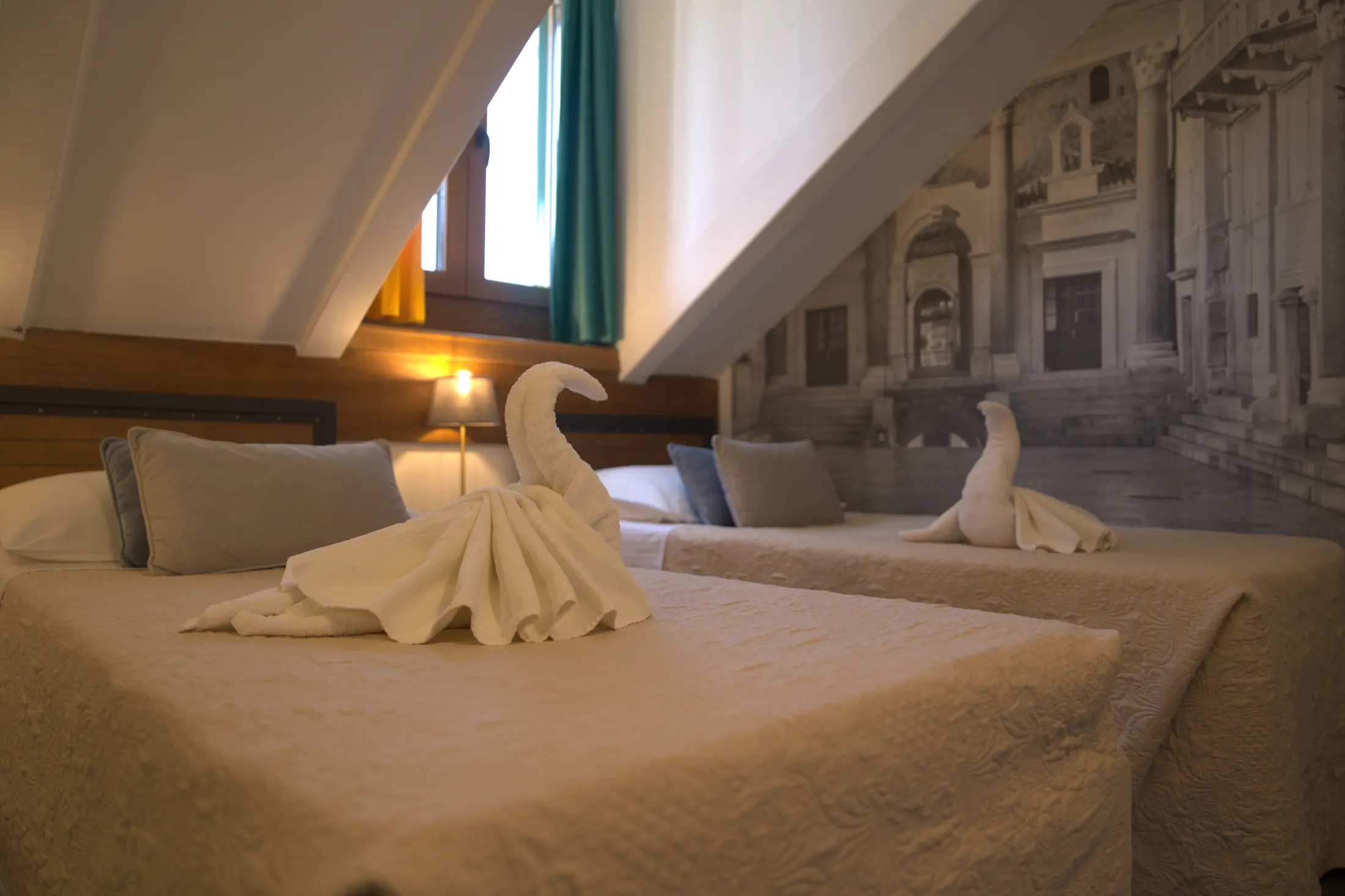 The Economy double room under the eaves, with sloping ceilings and a mural of Split, Hotel Villa Diana, Lučac, Split