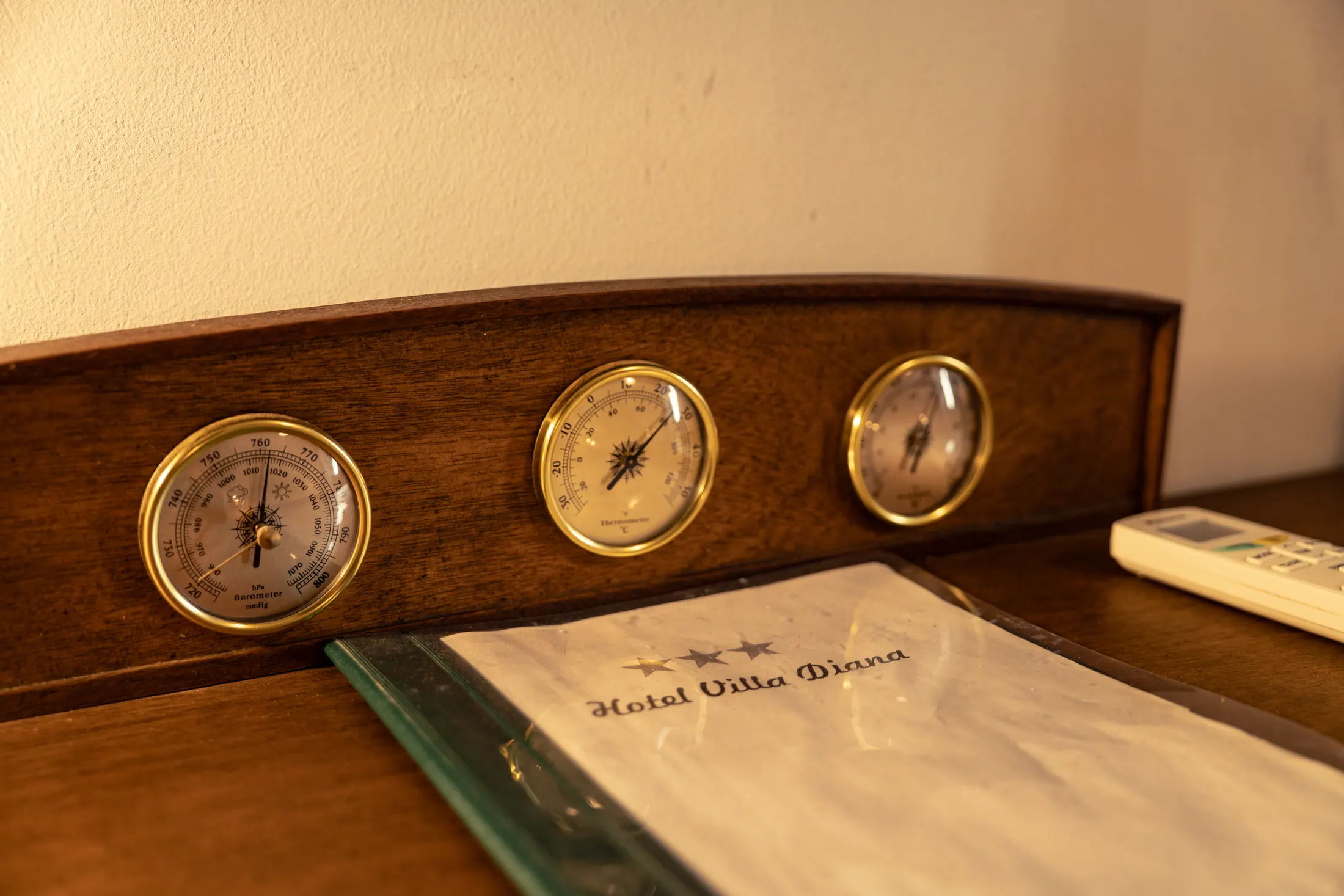 A barometer and thermometer above the desk in the room, Hotel Villa Diana, Lučac, Split