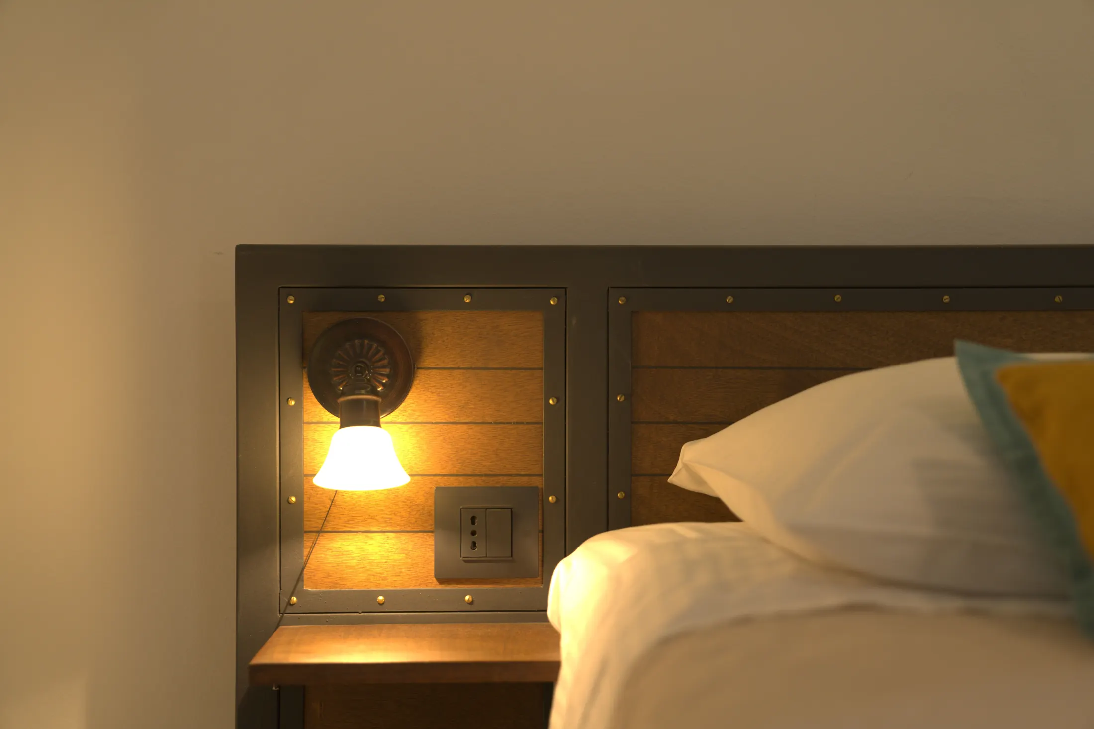 A reading lamp and socket set into the headboard, by the bed, Hotel Villa Diana, Lučac, Split