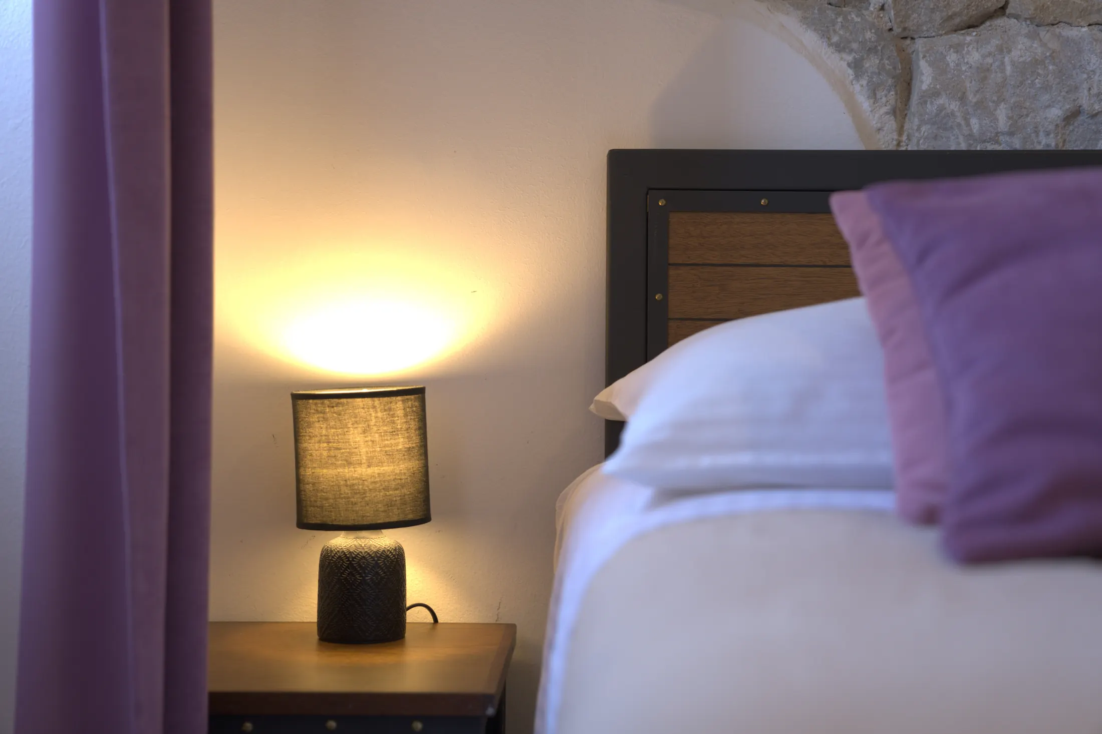 A bedside lamp on the nightstand, beside the mauve curtain, Hotel Villa Diana, Lučac, Split